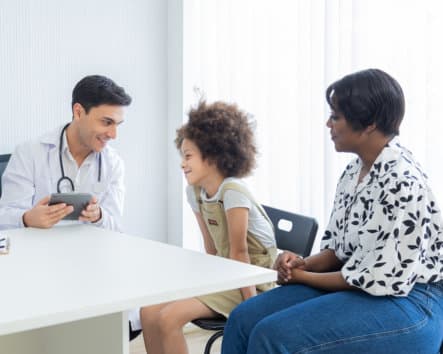 kid and her mother visiting their doctor