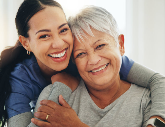 nurse hug senior patient