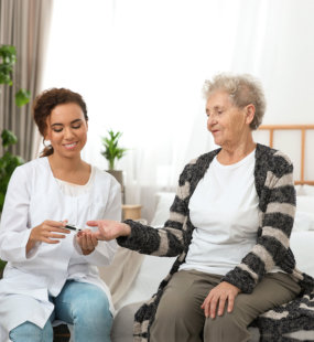 a female doctor checking the sugar of her patient