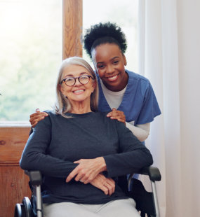 nurse and old woman with wheelchair