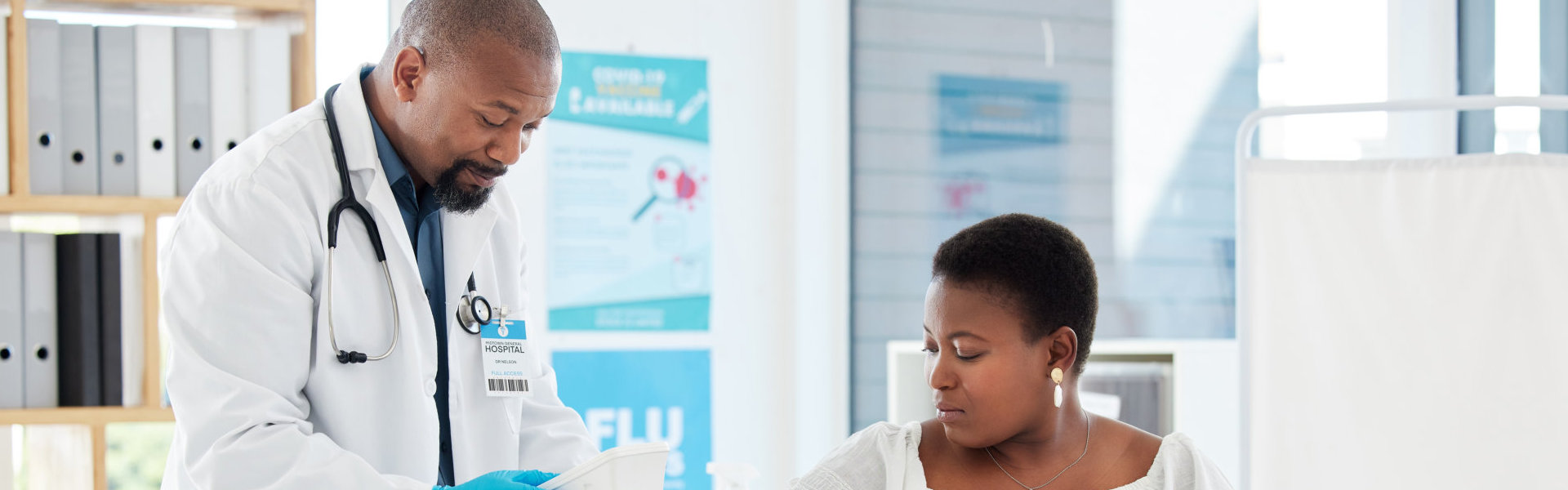 a doctor checking blood pressure of a patient